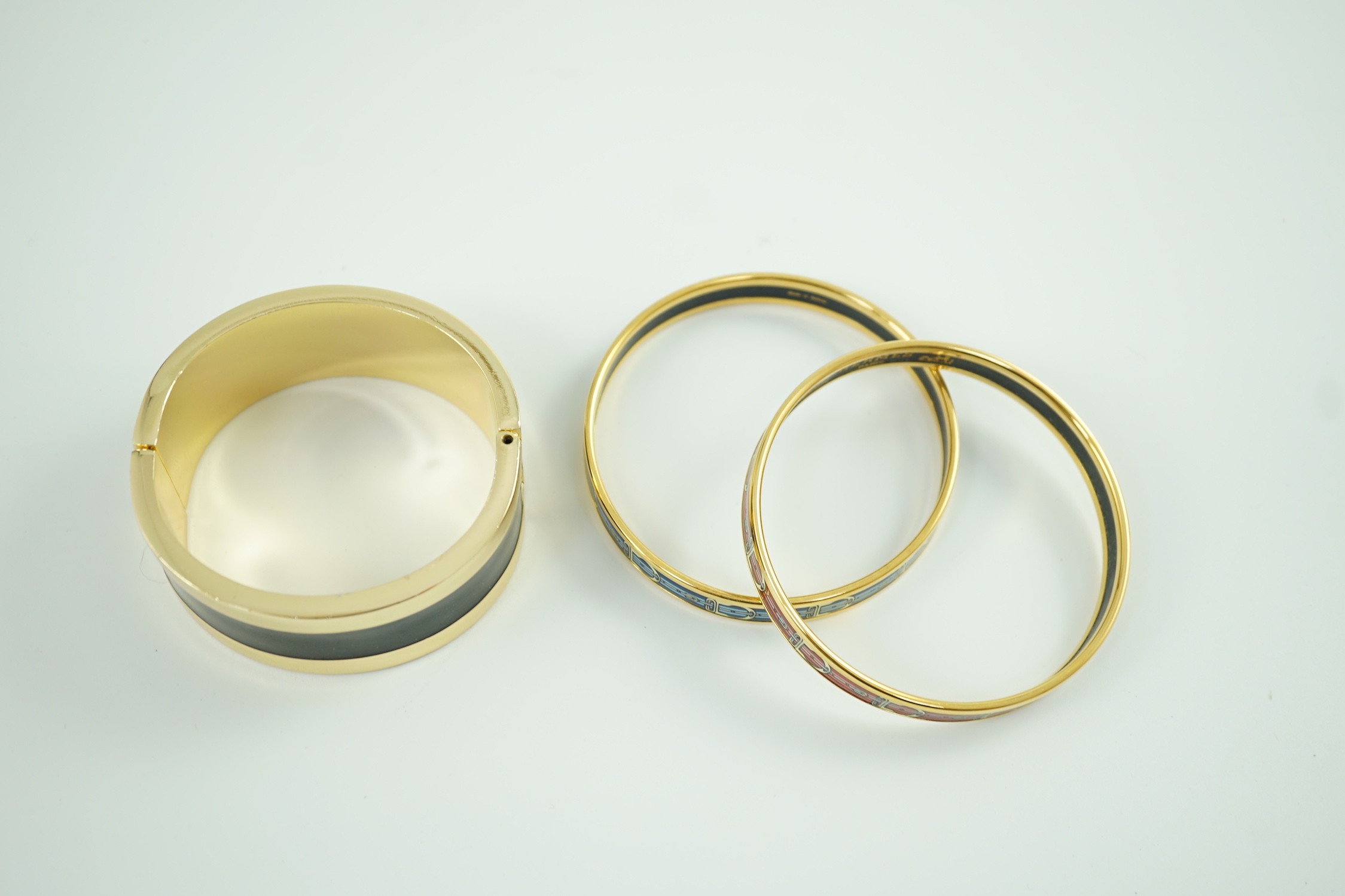 A boxed pair of Hermes enamelled bracelets and an unsigned bracelet in Lanvin box